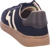 A side view of a navy blue sneaker with cream accents and a brown sole. Anteprima dell’immagine prodotto