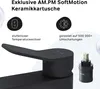 Close-up marketing image of a black faucet handle and cartridge, with text highlighting product features. Produktbild-Vorschau