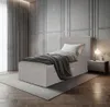 A bedroom scene with a single bed, nightstand, and curtains. Produktbild-Vorschau