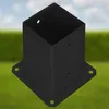 A black metal post anchor with a square base and four mounting holes, set against a blurred background of green grass and a blue sky with clouds. Produktbild-Vorschau