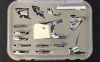 A set of sewing machine presser feet in a plastic storage case. Produktbild-Vorschau