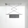 A ceiling-mounted clothes drying rack with towels hanging on it. Anteprima dell’immagine prodotto