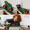 A collage of images showing a green LEGO monster truck with dragon features, being used by a child and on ramps made of books. Produktbild-Vorschau