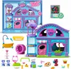 A Littlest Pet Shop playset and accessories are displayed, with the packaging in the background. Produktbild-Vorschau