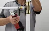 A person is using a tool to connect pipes. Anteprima dell’immagine prodotto