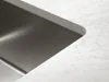 A close-up view of a stainless steel sink integrated into a marble countertop. Náhled obrázku produktu