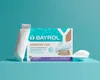 A box of BAYROL Superflock Plus pool treatment product is displayed on a blue surface against a turquoise background. A single cartridge is shown leaning against the box. Anteprima dell’immagine prodotto