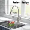 A kitchen faucet is shown with dimensions and a roll-up drying rack with vegetables in a sink. Anteprima dell’immagine prodotto