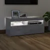 A modern TV stand with a DVD player and decorative items. Produktbild-Vorschau