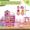 A dollhouse playset with dolls, furniture, and accessories, displayed on a wooden surface with a white and green background. Náhled obrázku produktu