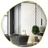 A modern bathroom with a black bathtub, herringbone tile wall, and a plant. Produktbild-Vorschau