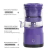 A purple electric juicer with descriptive text overlays. Podgląd zdjęcia produktu
