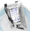 A smartphone is shown inside a waterproof bag, with water splashing around it. Náhled obrázku produktu