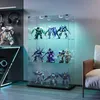 A display cabinet filled with various robot models, illuminated by LED lights. Podgląd zdjęcia produktu