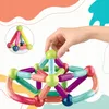 A hand is shown building a structure with colorful magnetic building blocks. Náhled obrázku produktu