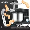 A black stand mixer with a meat grinder attachment and cookie cutters, with cookies being made. Produktbild-Vorschau