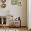 A hallway or entryway scene with a shoe rack, a record player, and decorative items on the wall. Produktbild-Vorschau