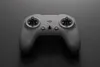 A gray drone remote control is shown from a top-down perspective against a dark gray background. Voir les images du produit