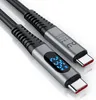 A close-up shot of a USB-C cable with a digital display showing power output. Produktbild-Vorschau