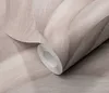 A roll of wallpaper with a textured wave pattern. Podgląd zdjęcia produktu