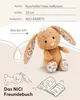 A plush bunny toy with descriptive text and illustrations. Produktbild-Vorschau