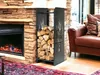 A fireplace with a wood rack filled with logs next to a brown leather sofa. Podgląd zdjęcia produktu