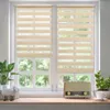 A well-lit interior scene featuring a window with two roller blinds, a potted plant, a decorative sheep figurine, and a vintage radio on a wooden surface. Voir les images du produit