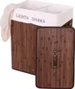 A brown bamboo laundry basket with two compartments and a lid. Produktbild-Vorschau