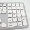 A close-up view of a gray and white keyboard with German QWERTZ layout. Anteprima dell’immagine prodotto