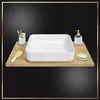 A white rectangular sink is placed on a wooden shelf against a black background, with bathroom accessories like a toothbrush holder, soap dispenser, and a small brush. Náhľad obrázku produktu