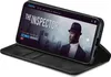 A smartphone in a black flip case is propped open, displaying a movie poster for 'The Inspector' on its screen. Produktbild-Vorschau