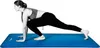 A woman is performing a yoga pose on a blue yoga mat. Podgląd zdjęcia produktu