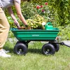 A person is gardening, using a green garden cart filled with plants and a watering can. Podgląd zdjęcia produktu