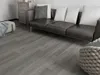 A living room scene with a sofa and flooring. Produktbild-Vorschau