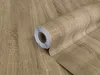 A roll of self-adhesive wood-effect film, designed to mimic the look of oak wood. Produktbild-Vorschau