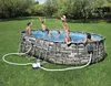 A family is enjoying a summer day in their backyard, playing in an oval-shaped above-ground swimming pool. Náhled obrázku produktu