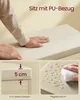 Close-up of a beige cushioned seat on a light wood base, with a person's hands touching the seat, and close-ups showing the seat thickness and water resistance. Produktbild-Vorschau