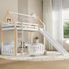 A children's bunk bed with a slide and a house-like frame, set up in a bedroom with soft lighting and decor. Produktbild-Vorschau