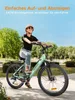 A woman riding a mint green electric bicycle in a park on a sunny day. Produktbild-Vorschau