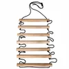 A wooden ladder with black ropes, suspended from the top. Produktbild-Vorschau