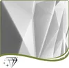 A close-up abstract view of a textured white geometric surface, likely a wall panel, with dramatic lighting creating shadows and highlights. Podgląd zdjęcia produktu