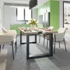 A dining room with a table and chairs, and a kitchen in the background. Produktbild-Vorschau