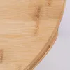 Close-up view of the edge and surface of a round bamboo cutting board. Produktbild-Vorschau