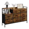 A dresser with fabric drawers and a wooden top, decorated with a lamp, books, and a framed map. Náhľad obrázku produktu