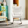 A cozy living room scene featuring a white rocking chair, a coffee table, and a teal cabinet. Produktbild-Vorschau