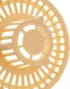 A close-up view of a beige plastic drain strainer with a grid pattern and a central circular element. Podgląd zdjęcia produktu