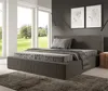 A modern bedroom with a large bed and a view of a garden through the windows. Náhled obrázku produktu