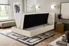 A bedroom scene with an open storage bed. Voir les images du produit