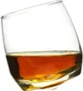 A single rocking whiskey glass filled with amber liquid, presented against a white background. Podgląd zdjęcia produktu