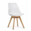 A white chair with wooden legs is shown against a white background. Náhled obrázku produktu